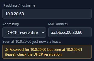 A warning in NetLay saying a device is reserved for one address but was seen at another, and to check the DHCP reservation.