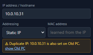 A duplicate address warning in NetLay saying the address is also set on another device, with a link to show it.
